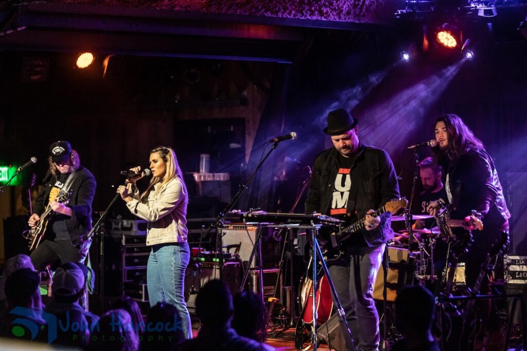 A group of artists perform at the Belly Up Tavern
