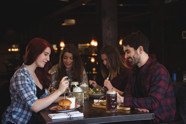 Friends Eating in Bar