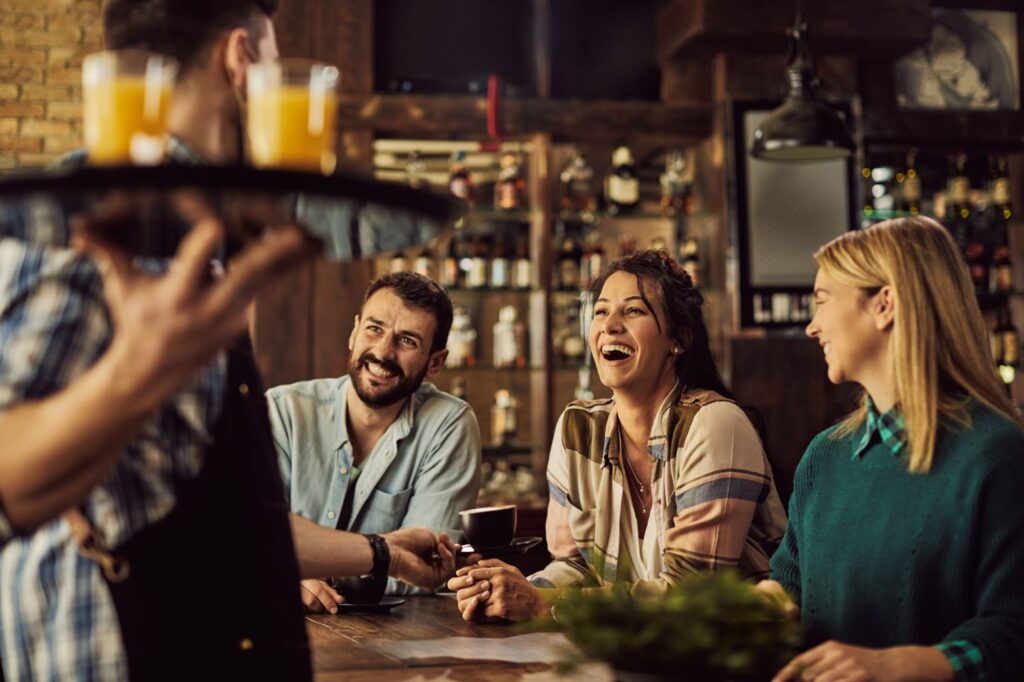 Cheerful friends having fun in a cafe